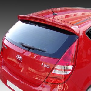 Rear view of a red hatchback car, showing the rear windshield, wiper, taillights, and badge area