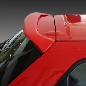 Close-up of a red car's rear spoiler on the trunk, showing an aerodynamic wing.
