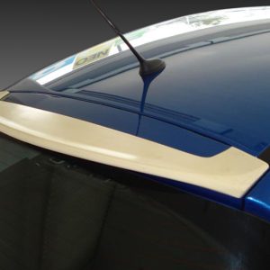 Blue car roof close-up showing a white rear spoiler, rear window, and an antenna on top.