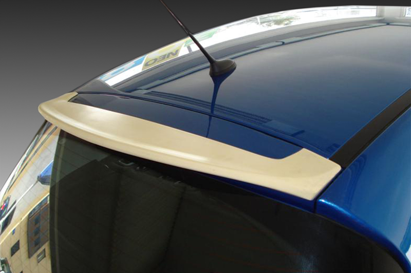 A-328_1jpg - OPSHOLDERS Blue car roof close-up showing a white rear spoiler, rear window, and an antenna on top.