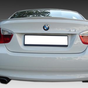 Rear view of a white BMW sedan, showing the BMW logo, 316i badge, taillights, and an empty license plate area.