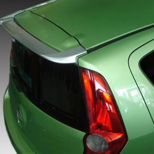 Rear view of a lime-green hatchback with a dark rear window and prominent red taillight