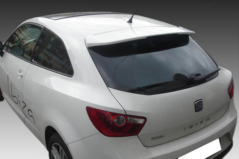 A-339_2jpg - OPSHOLDERS White hatchback car seen from the rear-right with red tail light and rear spoiler; side view mirrors and tinted rear window visible