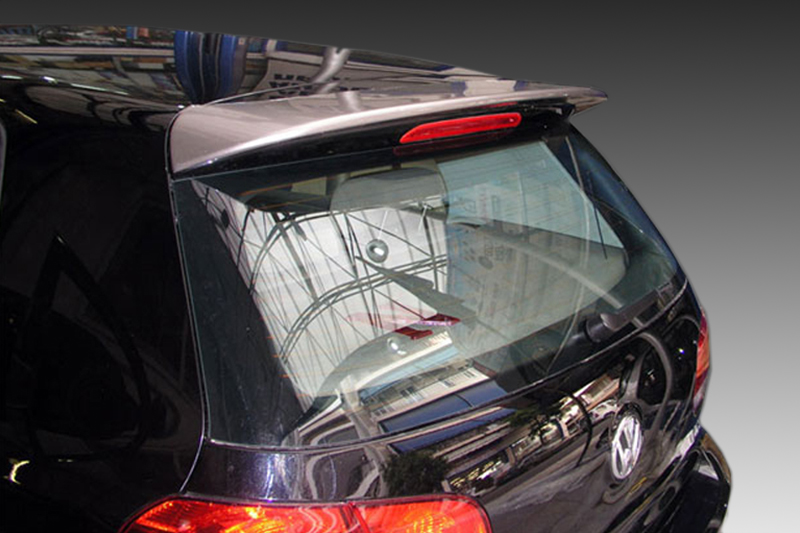 A-345_1jpg - OPSHOLDERS Rear view of a black Volkswagen hatchback with a curved rear window, red taillights, and chrome trim; reflections on the glass.