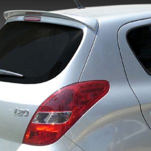 Rear three-quarter view of a silver Hyundai i20 hatchback, showing taillight, rear wiper, and part of the back door badge i20.