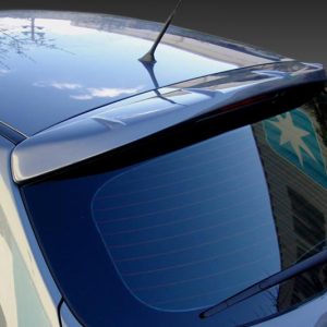 Rear view of a blue hatchback car showing the rear window, spoiler, and roof antenna, with reflections of the sky on the glass and body