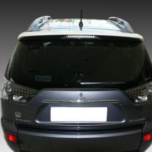 A-354_2jpg - OPSHOLDERS Rear view of a black Mitsubishi SUV (Outlander) with tinted rear window and visible badge, against a gradient backdrop.