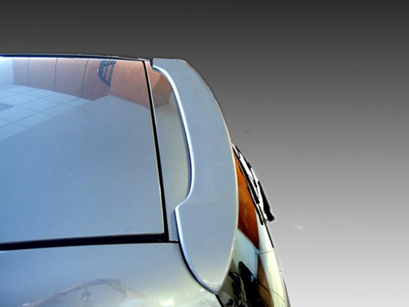 Close-up of a car's curved windshield and wiper against a gradient sky.