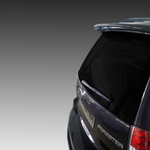 Rear view of a Subaru Forester SUV with dark, tinted tailgate and red taillight on the right side (hatchback design).