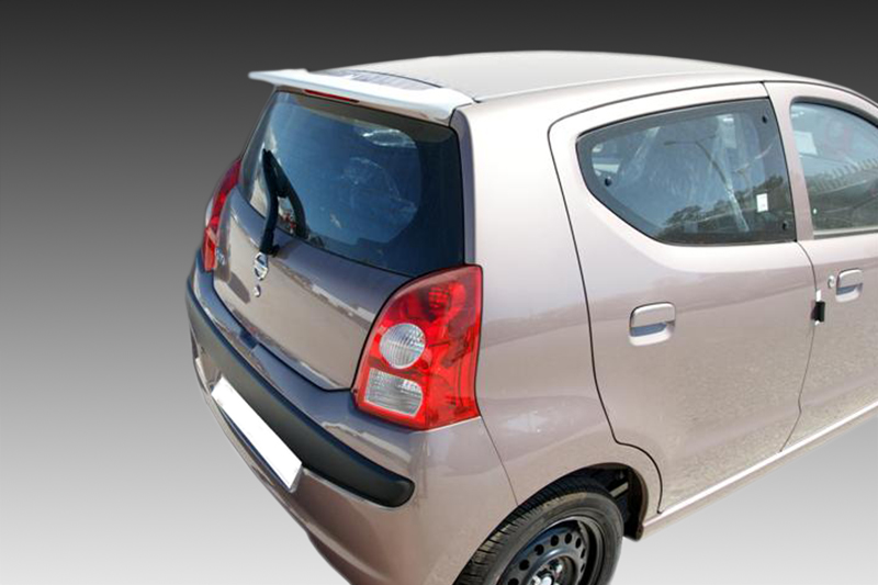 A-365_1jpg - OPSHOLDERS Rear three-quarter view of a beige hatchback parked, showing the back window wiper and red taillights