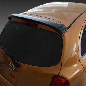 Orange hatchback viewed from the rear-left, showing a dark tinted rear window and integrated spoiler.