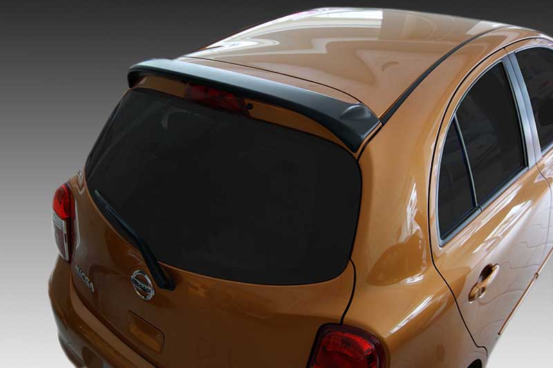 A-385_1jpg - OPSHOLDERS Orange hatchback viewed from the rear-left, showing a dark tinted rear window and integrated spoiler.