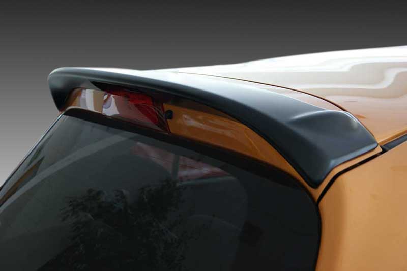A-385_2jpg - OPSHOLDERS Close-up of a black rear spoiler mounted on an orange car (hatchback).