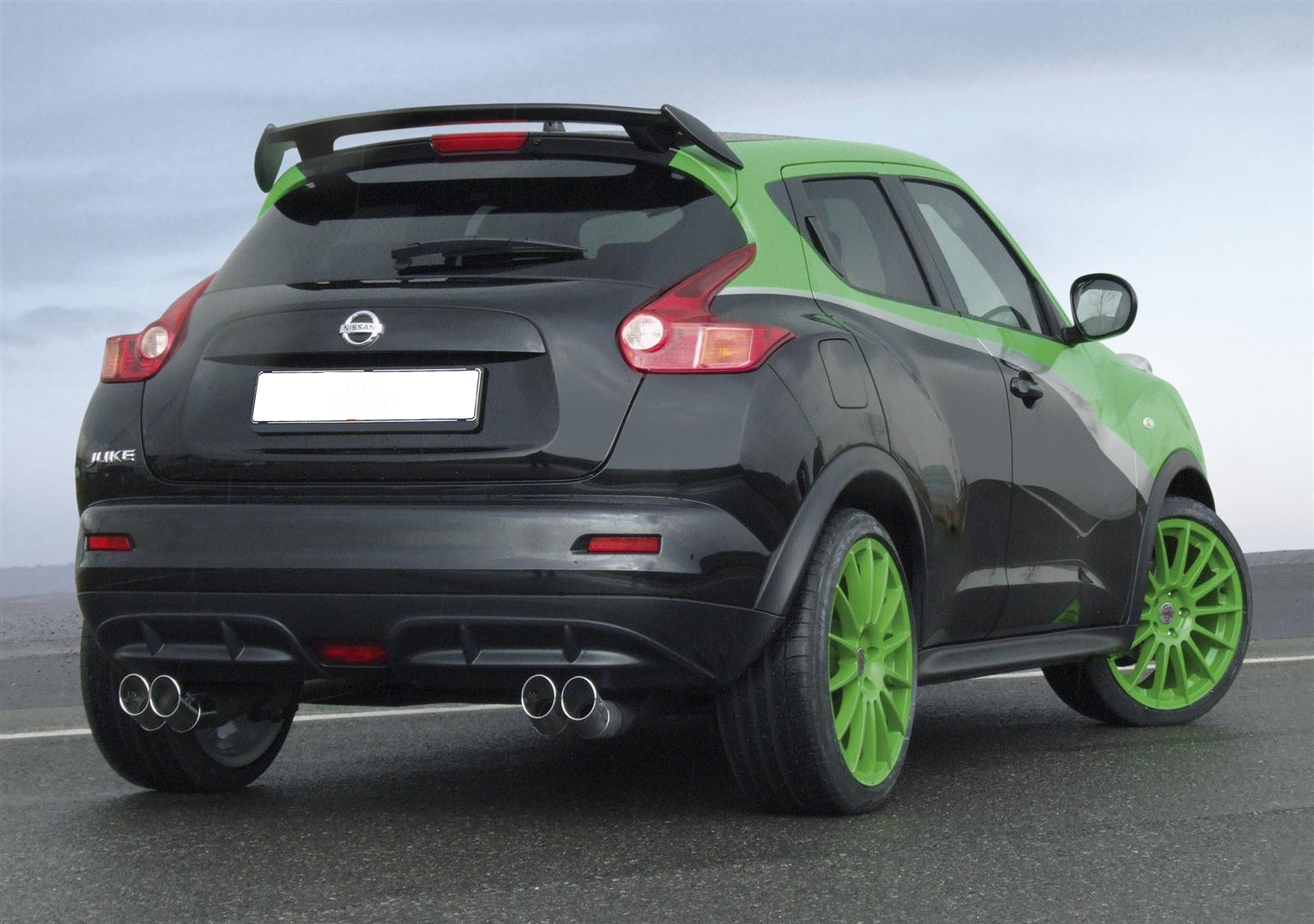 DCF 10 - OPSHOLDERS Rear three-quarters view of a black Nissan Juke with bright green rims and green roof accents.