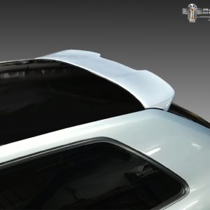 Top view of a light-blue car showing a rear lip spoiler on the trunk that adds downforce and sportiness.