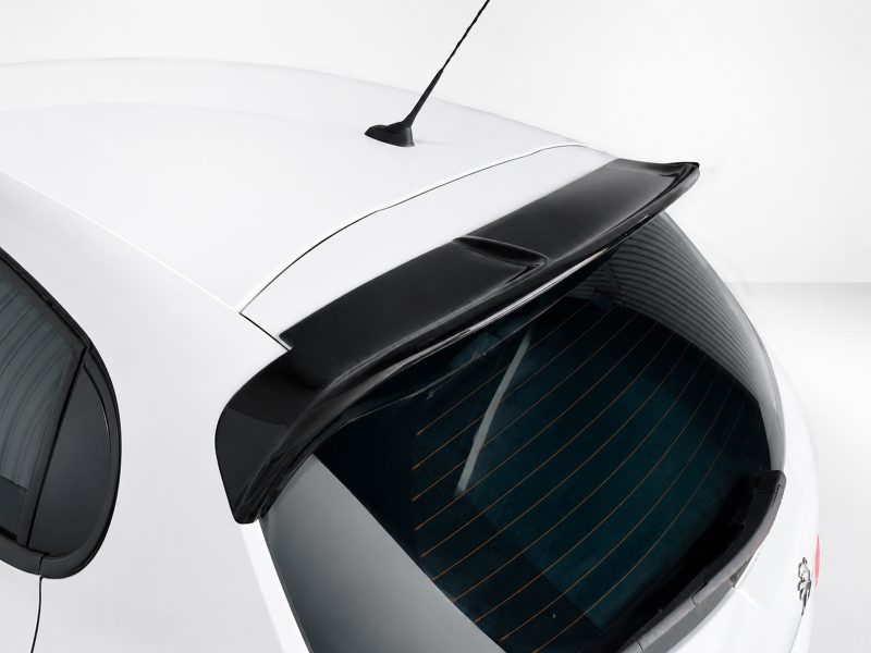 A-397_3jpg - OPSHOLDERS Top-down view of a white hatchback showing the rear window with defroster lines, a black roof spoiler, and a roof antenna.