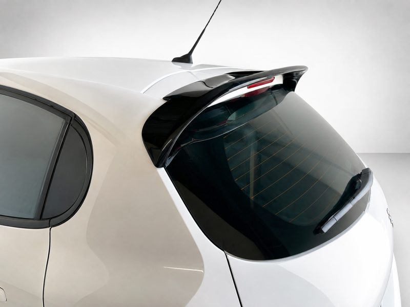 A-397_4jpg - OPSHOLDERS Rear hatch area of a white car with a curved rear window and integrated spoiler