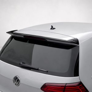 Rear view of a silver Volkswagen hatchback showing a roof spoiler and rear windshield wiper, badge visible on the tailgate