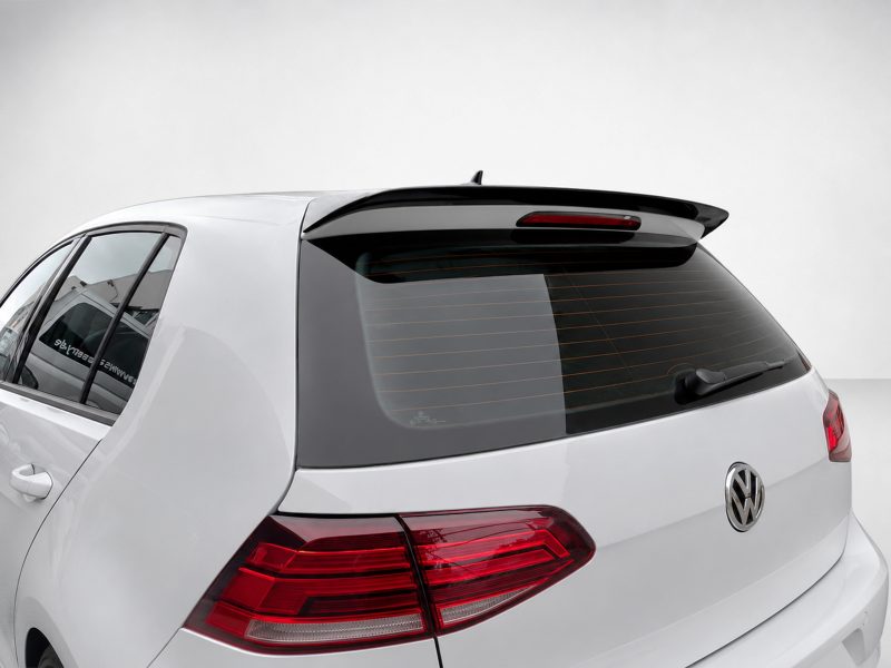 A-403_4jpg - OPSHOLDERS Rear three-quarter view of a white Volkswagen SUV with a rear spoiler and tinted rear window.
