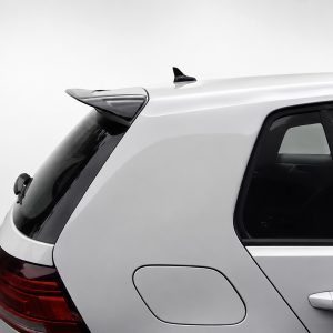 A-403_6jpg - OPSHOLDERS Rear quarter of a silver SUV showing taillight, rear window, and roof spoiler/antenna on top.