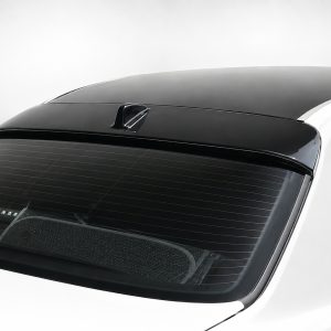 White car rear with a dark tinted rear window and a raised black roof spoiler centered at the top of the rear window