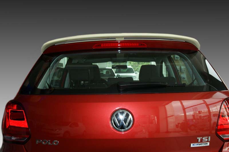A-405_2jpg - OPSHOLDERS Rear view of a red Volkswagen Polo hatchback with VW emblem and TSI Bluemotion badge, shown in a showroom.