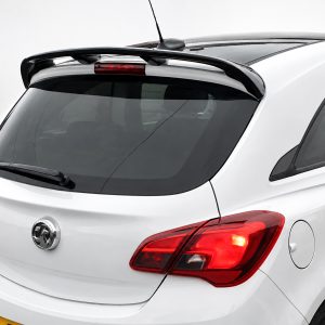 White hatchback car rear with integrated spoiler and rear window wiper, showing red taillights and Opel/Vauxhall Corsa badge