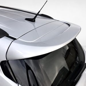 A-409_3jpg - OPSHOLDERS Close-up of a silver car roof showing a rear spoiler and roof antenna with a glossy finish.