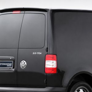 Black VW van seen from the rear side with split rear doors, VW badge, and a '2.0 TDI' badge on the panel.