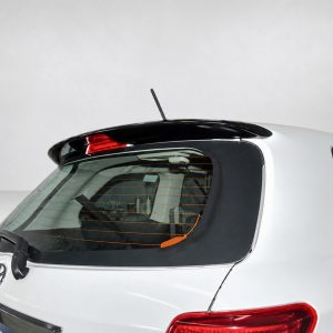 Rear of a silver hatchback showing the rear window, wiper, antenna, and high-mounted brake light on the spoiler area.
