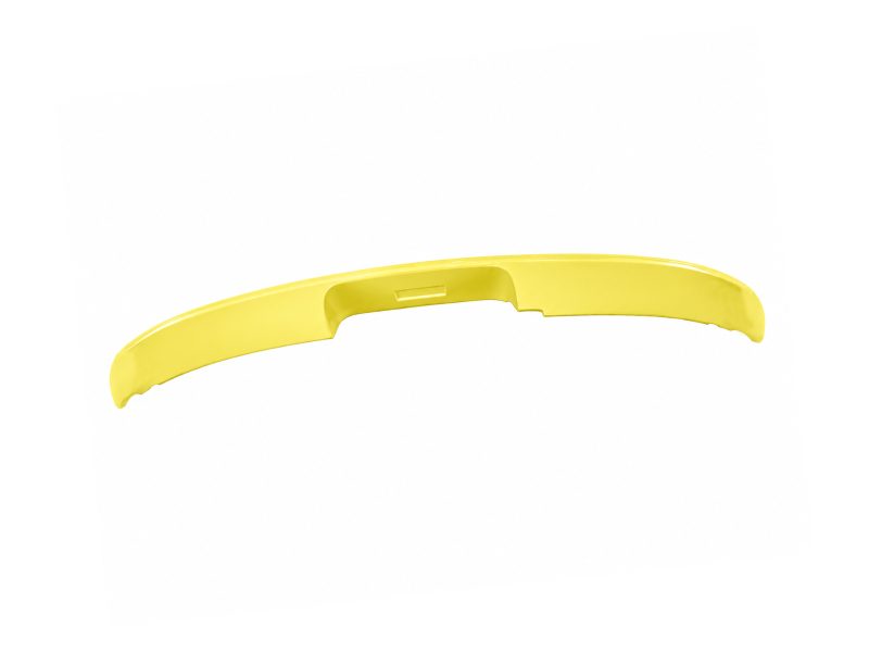 Curved yellow plastic component with a small central notch.