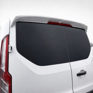 Rear view of a white van with dark-tinted rear windows and red taillights on the left side of the image