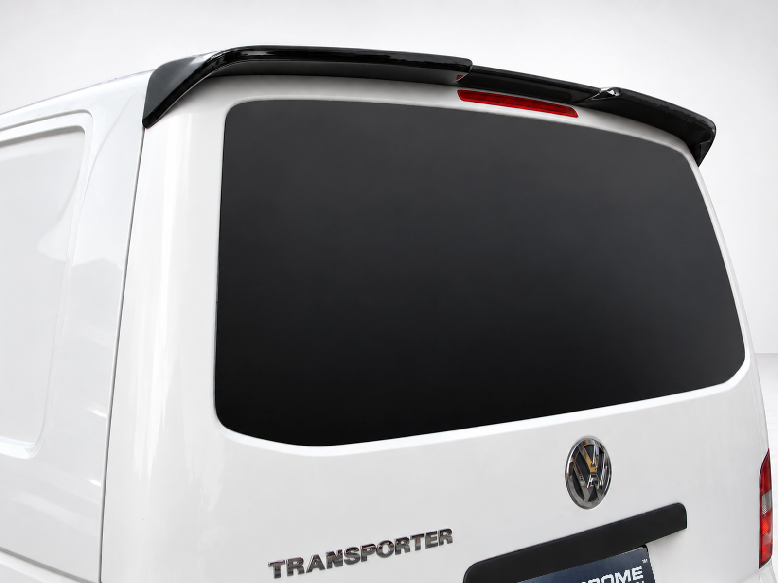 A-423_1jpg - OPSHOLDERS White VW Transporter van rear with darktinted rear window and black roof spoiler/wing, VW badge visible