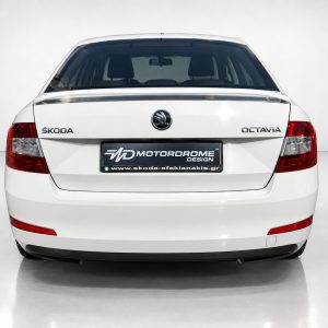 A-429_2jpg - OPSHOLDERS Rear view of a white Skoda Octavia with taillights, logo, and a Motordrome Design dealership plate in the center