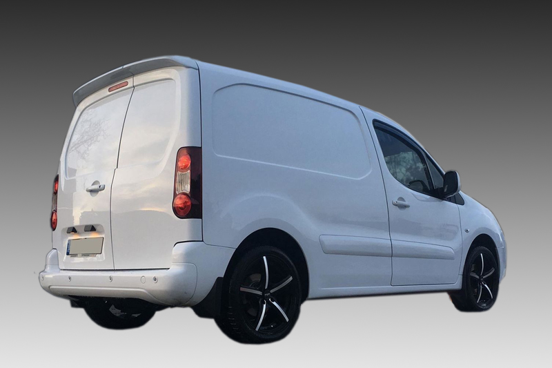 A-430_1jpg - OPSHOLDERS White cargo van photographed from the rear-right, showing closed doors and black alloy wheels on a gray gradient background.