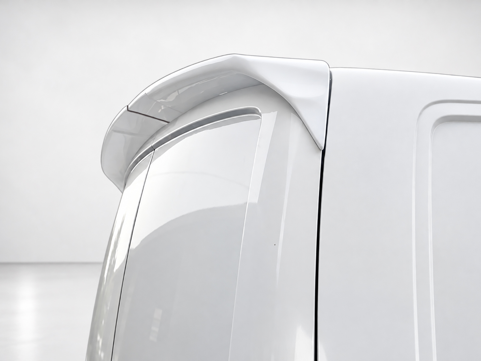 A-431_1jpg - OPSHOLDERS Close-up of a white car's rear spoiler mounted on the trunk, showcasing smooth curves and glossy finish.