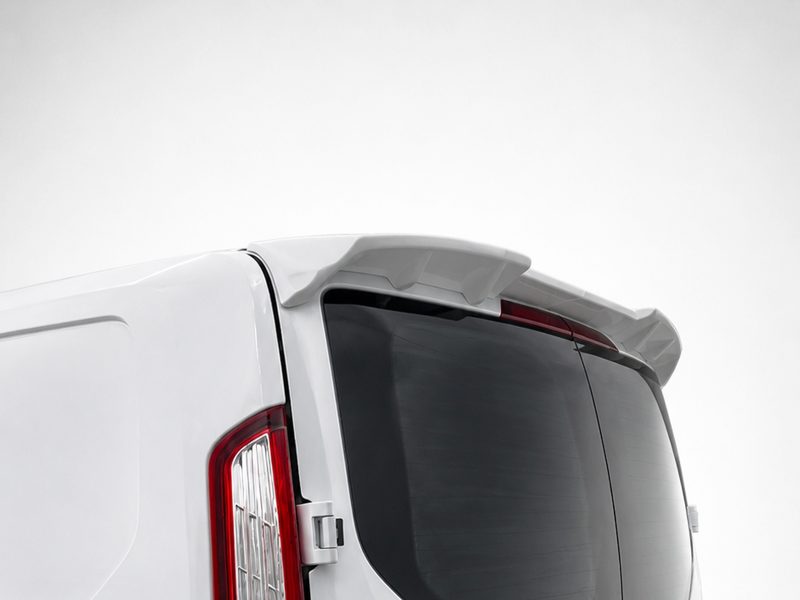 White rear of a van with an integrated rooftop spoiler above the rear window