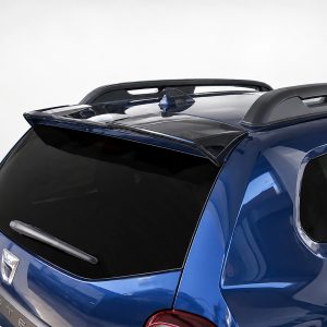 Blue Dacia Duster SUV seen from the rear, showing roof rails and a small spoiler above the rear window.