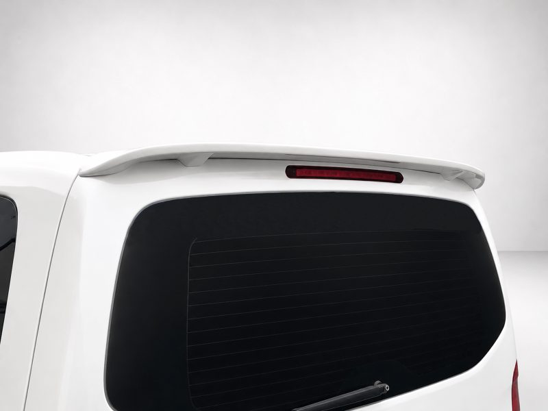 A-442_4jpg - OPSHOLDERS White SUV rear with a small spoiler on the roofline above the rear window and a red brake light integrated into the spoiler.