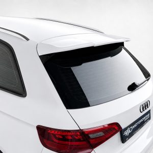 White SUV rear view featuring a roof spoiler and dark rear window, with red taillights visible.