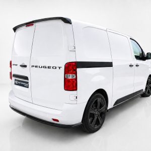 White Peugeot Expert cargo van shown from the rear-left side in a studio setting, with black trim and visible wheels.