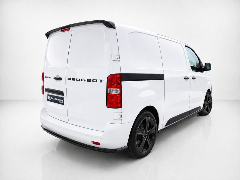 White Peugeot Expert cargo van shown from the rear-left side in a studio setting, with black trim and visible wheels.