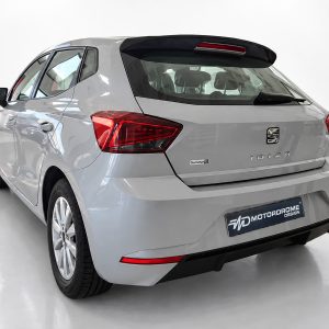 A-451_2jpg - OPSHOLDERS Silver SEAT Ibiza hatchback from a rear three-quarter angle, showing taillights and rear badge in a studio setting.