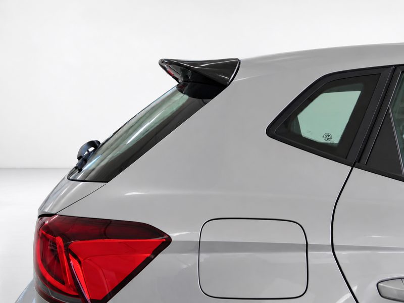 A-451_4jpg - OPSHOLDERS Silver car rear quarter with a small black roof spoiler, red tail light, and visible rear window contours.
