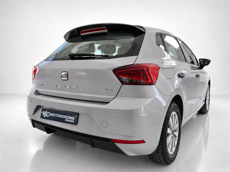 A-451_5jpg - OPSHOLDERS Rear three-quarter view of a silver SEAT Ibiza hatchback in a studio, showing taillights and badges (Ibiza, TSI).