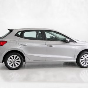 A-451_6jpg - OPSHOLDERS Side profile of a silver compact hatchback car photographed in a white studio setting.