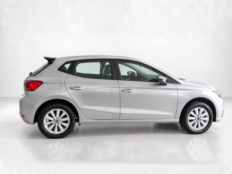 A-451_6jpg - OPSHOLDERS Side profile of a silver compact hatchback car photographed in a white studio setting.
