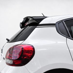 White hatchback rear with black spoiler, taillight, and racing stripe along window line.