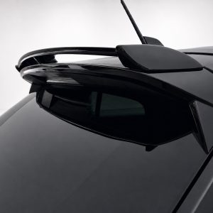 A-456_4-1jpg - OPSHOLDERS Close-up of a black car roof showing a sleek rear spoiler and antenna.
