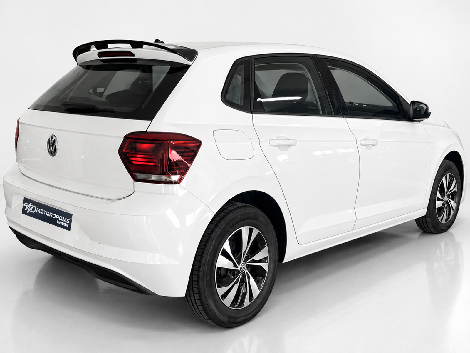 A-457_2jpg - OPSHOLDERS White compact hatchback photographed from the rear-right three-quarter angle in a studio.